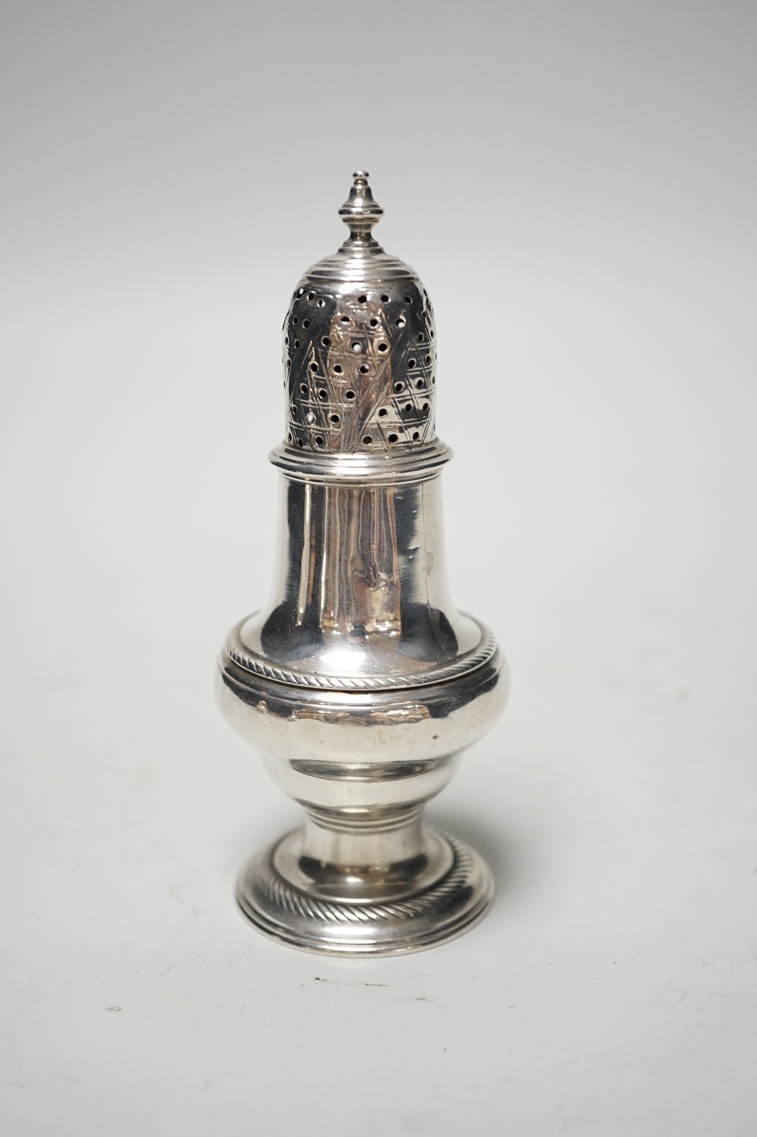 A George II silver baluster pepperette, John Delmester, London, 1757?, 13.1cm, 94 grams.